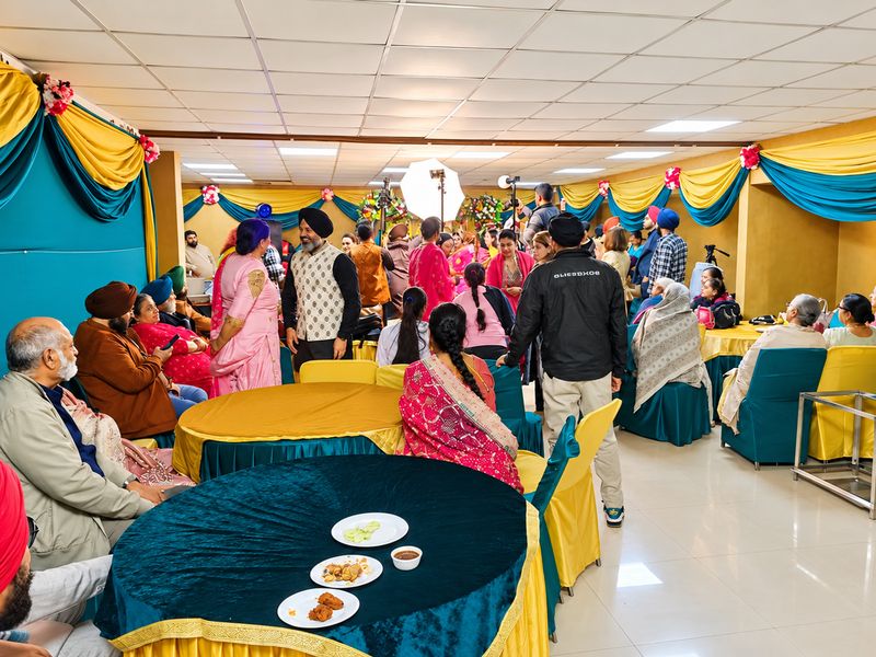 Guests gathered for a wedding function in the hall