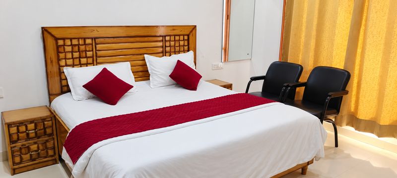 A double room with a red runner