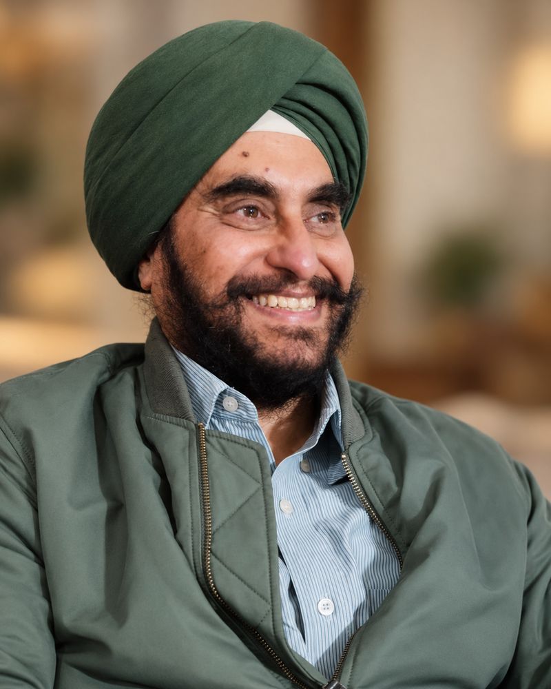 Mohandeep Pahwa, smiling, in a green turban