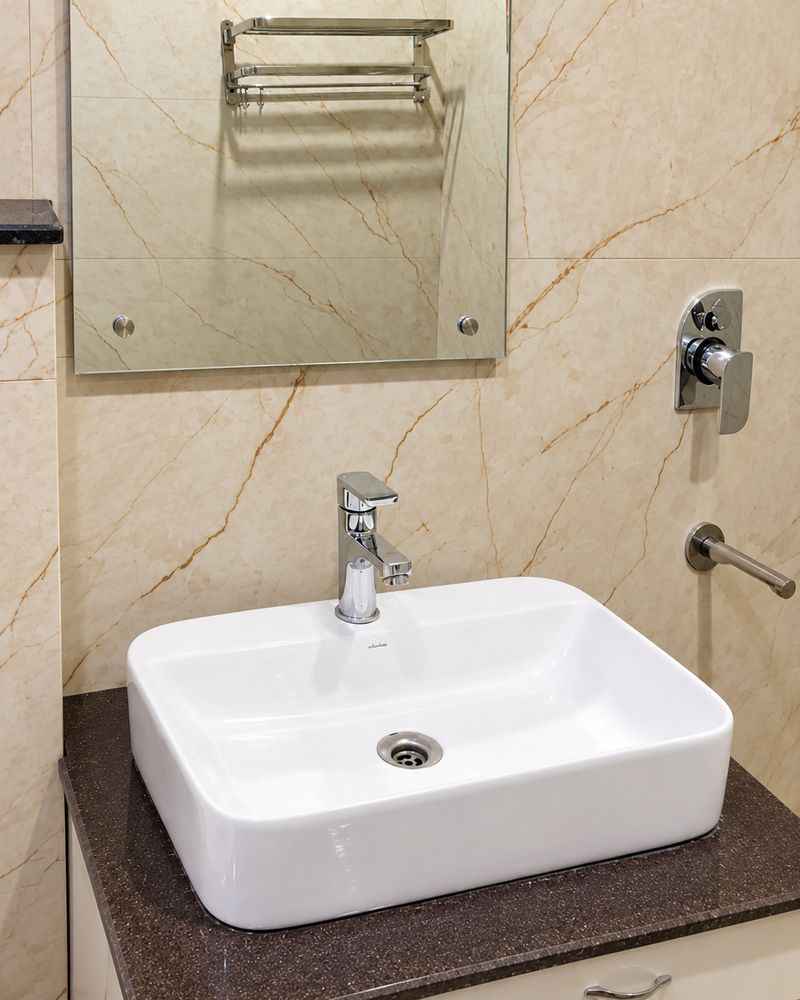A bathroom vanity with marble-look tiles